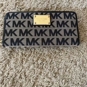 Brown and black MK wallet.